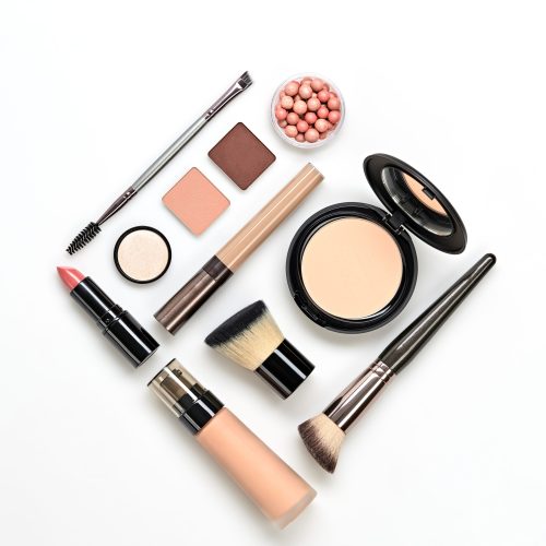 Beauty cosmetic makeup background. Fashion woman make up product, brushes, lipstick, nail polish layout. Creative pink concept. Cosmetology make-up accessories banner, top view.